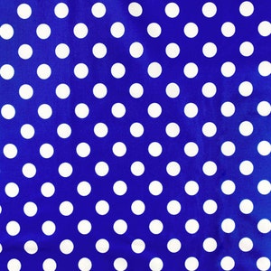 May include: A blue fabric with a white polka dot pattern.