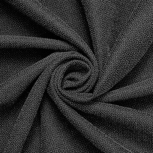 May include: Black fabric with a textured surface, folded and twisted into a spiral shape.