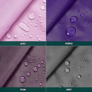 May include: Close-up of four fabric swatches in lilac, purple, plum, and grey. Water droplets are visible on the fabric. The colors are labeled with text: "LILAC", "PURPLE", "PLUM", and "GREY".