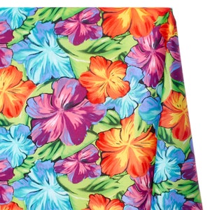 May include: A vibrant green fabric with a tropical floral print featuring large, colorful hibiscus flowers in shades of pink, blue, orange, and yellow.
