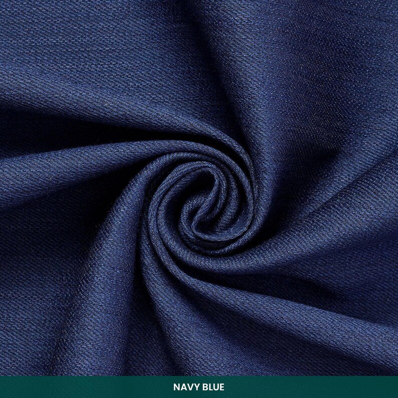 May include: Close-up of navy blue fabric with a swirling pattern. The fabric is a deep shade of blue, with visible texture and folds. The text "NAVY BLUE" is at the bottom of the image.