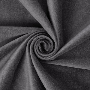 May include: Close-up of a grey fabric with a soft, velvety texture. The fabric is folded and twisted, creating a swirling pattern.