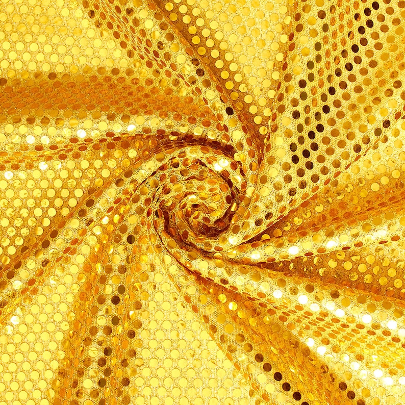 May include: A gold fabric with a swirling pattern of small, round sequins.