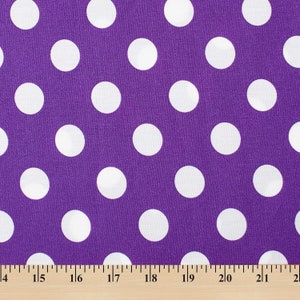 May include: Purple fabric with a white polka dot pattern. The fabric is measured with a ruler in inches.