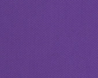 May include: A close-up of a purple fabric with a textured surface.