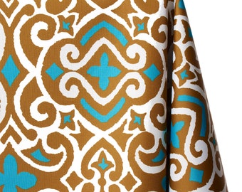 May include: A brown and white tablecloth with a turquoise blue geometric pattern. The pattern is a repeating design of swirls and diamonds.