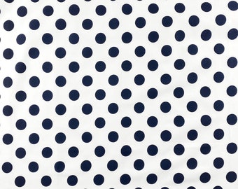 May include: White fabric with a repeating pattern of navy blue polka dots. The dots are evenly spaced and create a classic, playful design. This textile is suitable for various sewing and crafting projects.