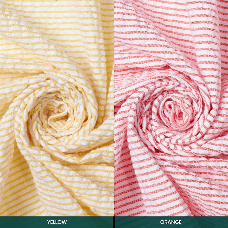 May include: Close-up of two rolled textiles. One is yellow and white striped, the other is orange and white striped. The bottom of the image has the text "YELLOW" and "ORANGE" in a green bar.