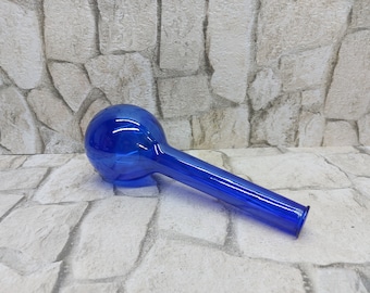 May include: A cobalt blue glass water pipe with a rounded bulb and a long, slender stem. The pipe is made of transparent glass and is designed for smoking. The object is set against a neutral background.