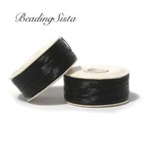 May include: Two spools of black beading thread, each with a white label.