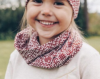 Jersey tunnel scarf with Latvian folkloric inspired design