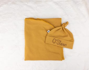 Name embroidered baby swaddle and hat set mustard yellow brown