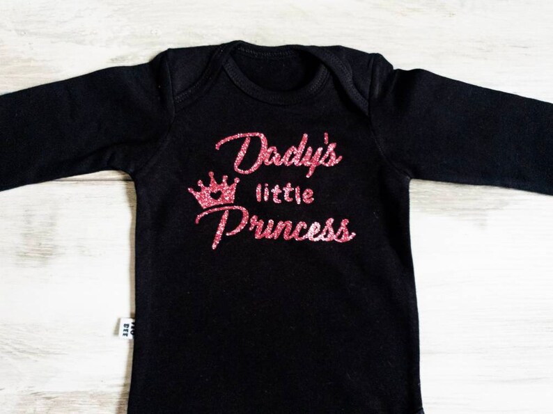 Black baby bodysuit with pink glitter text Dady/'s Little Princess