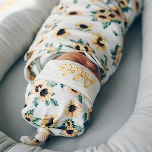 Sunflower swaddle set with embroidered name top knot hat