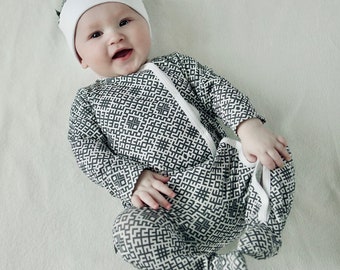 Grey Latvian design baby sleeper with bonnet or top knot hat, footed onepiece with snaps