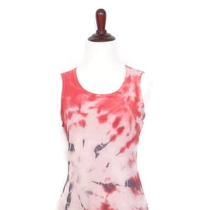 May include: A sleeveless tie-dye tank top in shades of red, pink, and white. The top has a relaxed fit and a scoop neck.