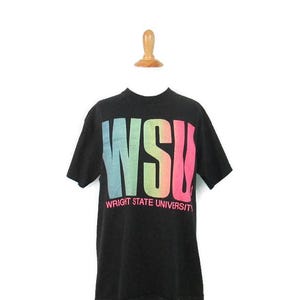 May include: Black short-sleeved t-shirt with a rainbow gradient graphic of the letters "WSU" and the text "Wright State University" underneath.