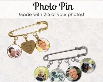 May include: Two photo pins with different designs. The first pin is gold and has a heart charm with the text "you are always in my heart" and three round charms with photos. The second pin is silver and has four round charms with photos.