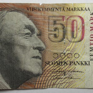 May include: A vintage 50 Markkaa banknote from Finland, featuring a portrait of a man on the front. The note has a brown and tan color scheme with text in Finnish. The serial number 3031540968 is visible.