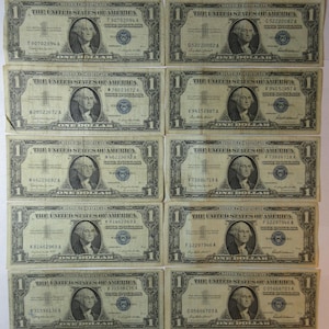 Ten 1957 One Dollar Blue Seal Silver Certificates (#E37b)