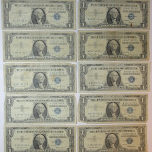 Ten 1957 One Dollar Blue Seal Silver Certificates (#E930d)