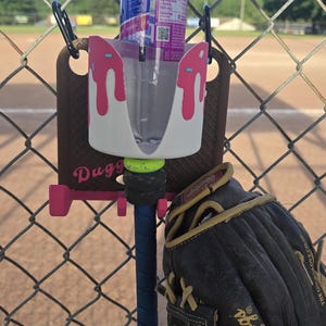 Duggy™- Ice Cream Drip Dugout Organizer – Hot Pink Edition Hanging Bat & Gear Rack for Baseball Softball Teams