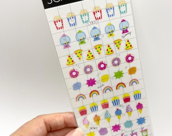 May include: A sheet of Mind Wave Inc. Schedule Seal stickers featuring small, colorful icons including popcorn, gumball machines, pizza slices, donuts, rainbows, french fries, ice cream, speech bubbles, drinks, and bandages arranged in a grid.