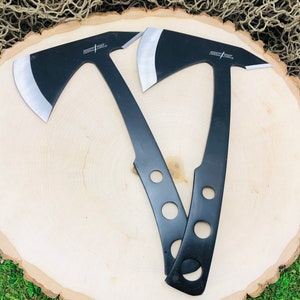 May include: Two black throwing axes with silver blades and the text "Fury Axe" on the handles. The axes are on a wooden surface.