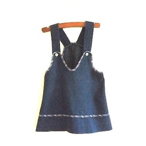 Vintage denim dress for a little girl with rainbow trim
