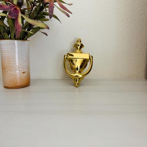 Vintage metal door knocker, gold, colonial