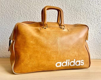 RARÍSSIMA!! Bolsa Adidas anos 70 MFS, fabricada na França, autêntica, vintage, para viagens, academia, peça única e exclusiva, nunca usada, retrô, bege, com propaganda.