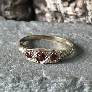 An Unusual Trilogy Three Stone Garnet And Diamond Ring    SKU 2947