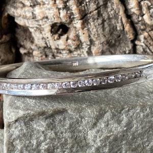 A Pretty Silver And  Cubic Zirconia Bangle    SKU8753