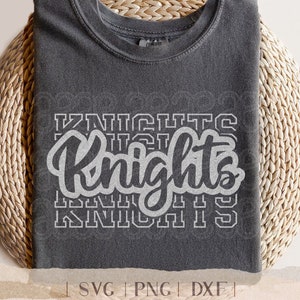 May include: Dark grey t-shirt featuring the word "Knights" in a white, layered, script font. The shirt is displayed on a woven, circular surface. The bottom of the image includes the text "SVG | PNG | DXF".