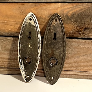 May include: A handmade wooden sign with the text "Welcome" in a playful font. The sign features a distressed white background and a dark brown border, perfect for a front door or entryway. The sign measures approximately 12 inches wide and 6 inches tall.