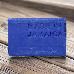 May include: A blue bar of soap with the words "Made in Jamaica" embossed on the front.