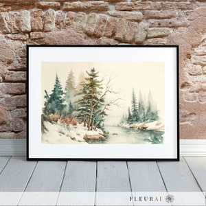 May include: A framed watercolor painting of a winter landscape. The artwork depicts snow-covered trees, a river, and a soft, muted color palette of greens, blues, and browns. The painting is in a black frame and is displayed against a brick wall.