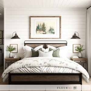 May include: A bedroom with a bed featuring a wooden headboard and a black metal frame. The bed is made with white bedding, green pillows, and a patterned comforter. A framed watercolor painting hangs above the bed, and two sconces flank it. Two nightstands with plants are on either side.