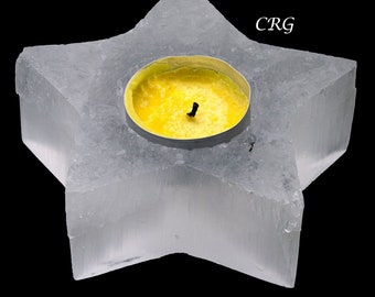 May include: A clear, star-shaped candle holder made of selenite crystal with a yellow candle inside.