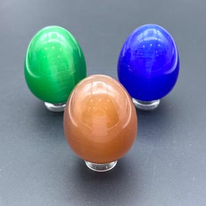 Cat Eye Glass Egg Carving – 1.75 Inches Gemstone Egg for Home Decor