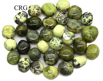 May include: A collection of green and white tumbled serpentine stones. The stones are smooth and polished, with a variety of patterns and textures.