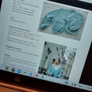 May include: A light blue knitted cardigan with a tie closure. The garment measurements include a chest measurement of approximately 130 cm and a full mid-back length of approximately 52 cm. The yarn is Lineapiu Italia.