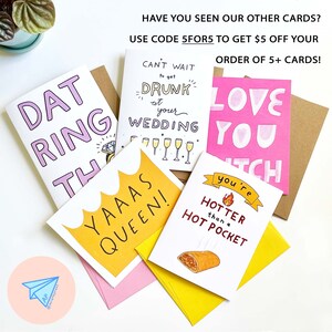 May include: A collection of greeting cards with various designs and messages. The cards feature phrases like "DAT RING THO," "Can't wait to get drunk at your wedding," and "You're hotter than a hot pocket." The image also includes the text "Have you seen our other cards?"