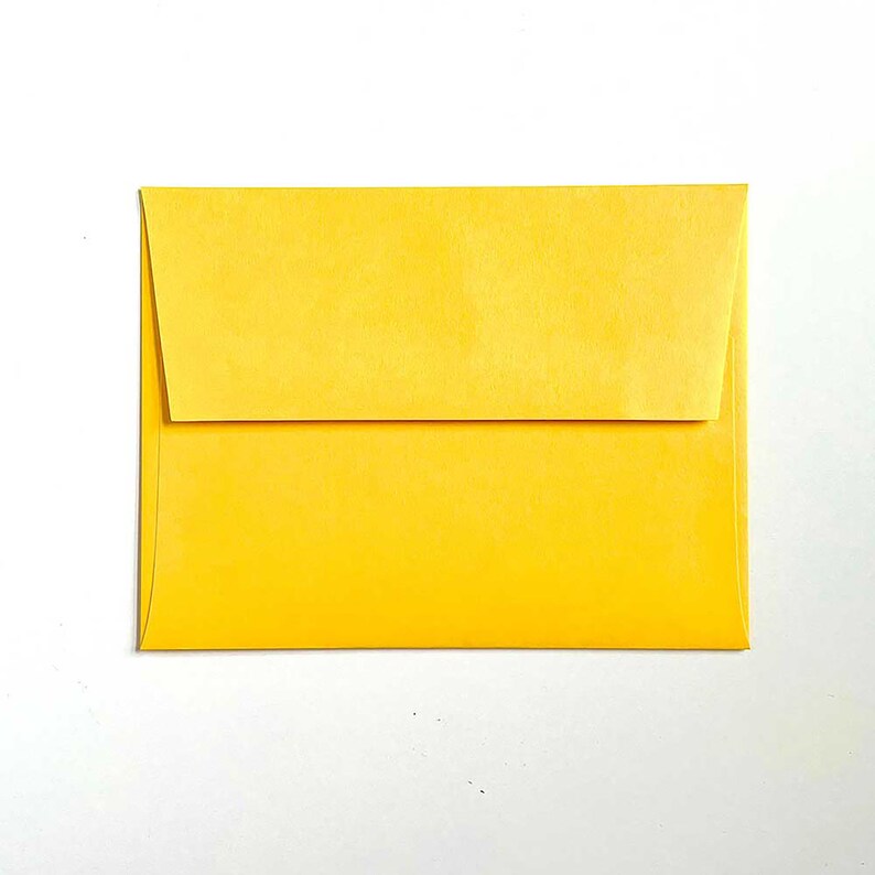 May include: A bright yellow envelope with a flap.
