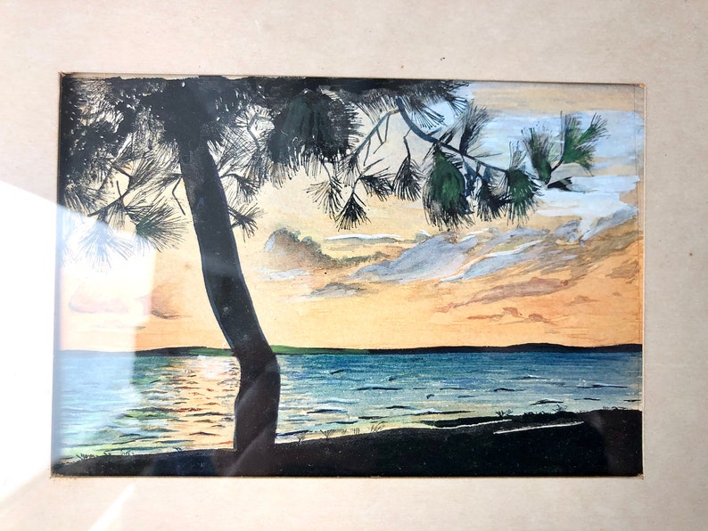 May include: A watercolour painting depicting a sunset over a lake, with a silhouette of a pine tree in the foreground. The sky is a blend of orange, pink, and blue, with wispy clouds. The water is a deep blue, reflecting the sunset.