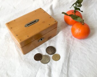 Old wooden piggy bank box