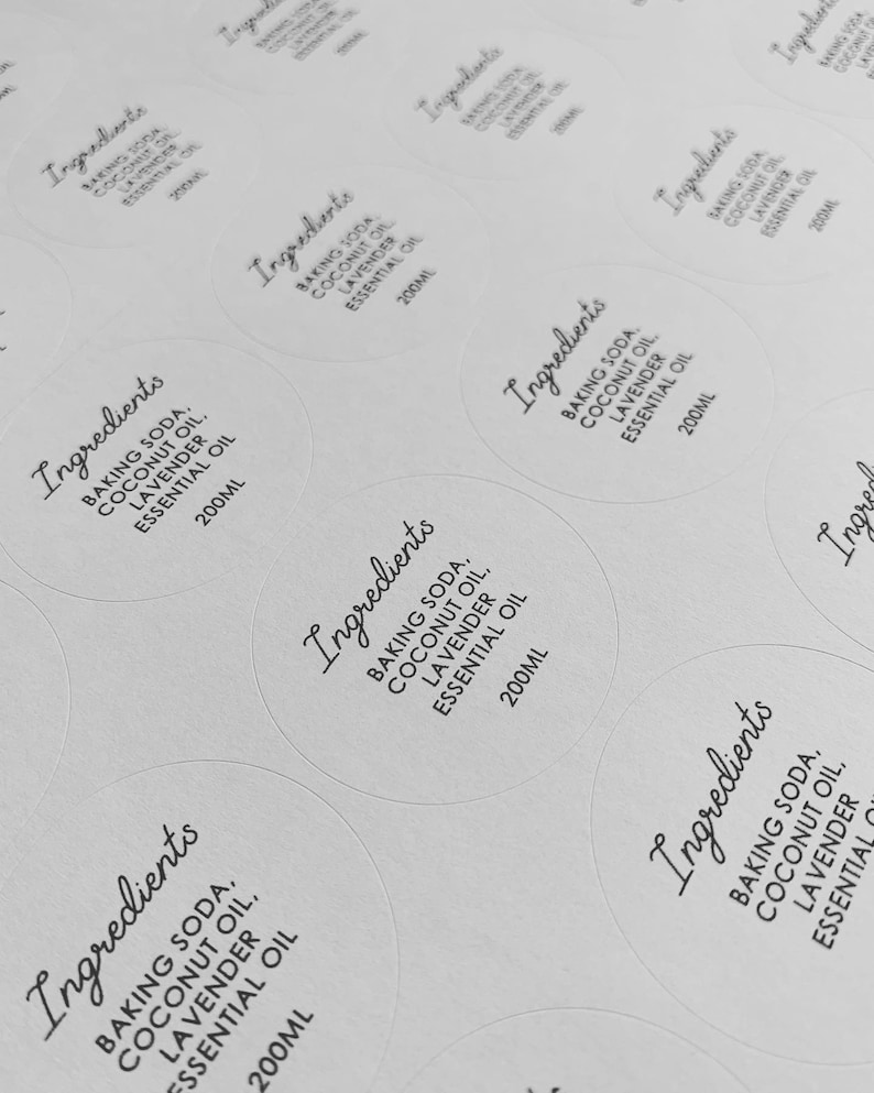 May include: White round labels with black text that reads "Ingredients: Baking Soda, Coconut Oil, Lavender Essential Oil, 200ml".