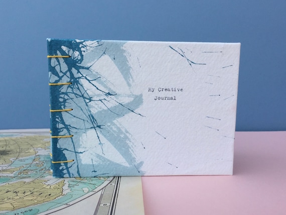 personalised eco friendly sketchbook, hand painted and hand bound.