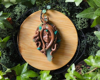 The goddess of the undergrowth: Goddess of the forest pendant in polymer paste set with a hint of aventurine