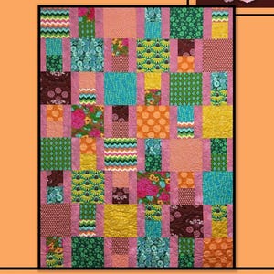 May include: A colorful quilt with a patchwork design. The quilt features squares of various patterns and colors, including floral, polka dots, and geometric shapes. The word "RODEO" is at the top, and "Villa Rosa Designs" is at the bottom. A pink rose is in the upper right corner.